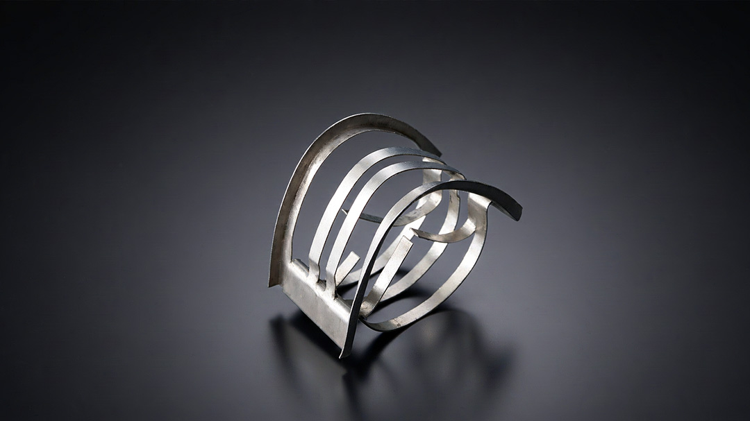 Metal Super Raschig Rings in four sizes #25 #38 #50 #70 arranged for scale comparison